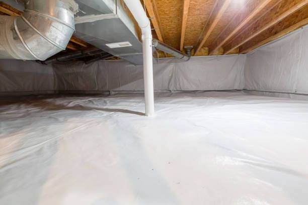 Newly installed reinforced vapor barrier wrapped around cinder-block piers and sealed across the crawl space soil in a Portland-area home